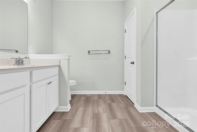 3207 Selwyn Landing Dr, Charlotte, NC 28215 - bathroom featuring a stall shower, vanity, and wood finished floors