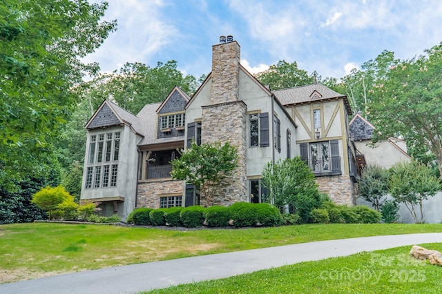 3587 Ridgetop Rd, Sherrills Ford, NC 28673 - view of home's exterior with stone siding, a yard, a chimney, and stucco siding