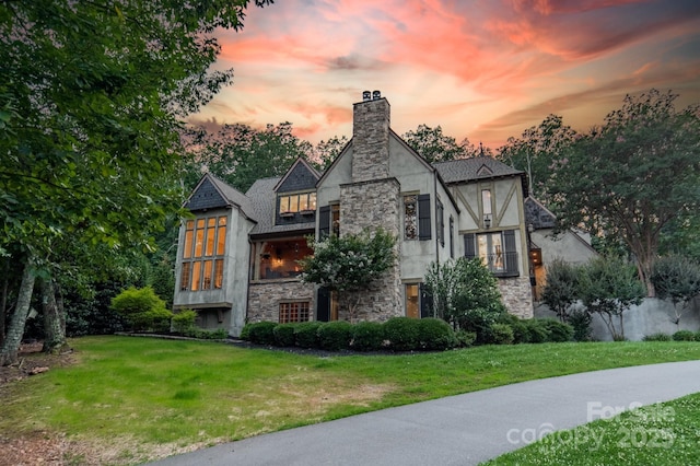 3587 Ridgetop Rd, Sherrills Ford, NC 28673 - tudor home featuring stone siding, a front lawn, a chimney, and stucco siding