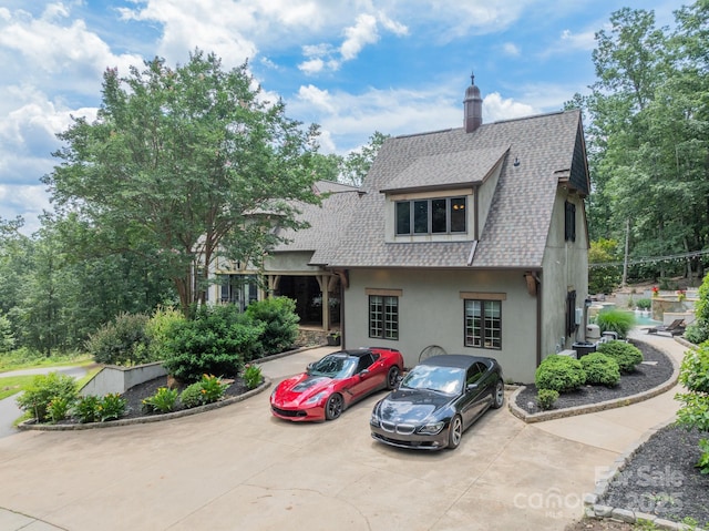 3587 Ridgetop Rd, Sherrills Ford, NC 28673 - tudor home with stucco siding, roof with shingles, and a chimney