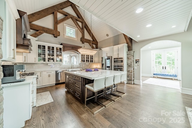 3587 Ridgetop Rd, Sherrills Ford, NC 28673 - kitchen with stainless steel appliances, glass insert cabinets, white cabinetry, backsplash, and a wooden ceiling with exposed beams