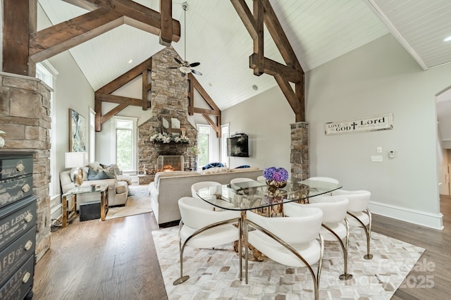 3587 Ridgetop Rd, Sherrills Ford, NC 28673 - dining room featuring a fireplace, wood finished floors, high vaulted ceiling, ceiling fan, and a wood ceiling with exposed beams