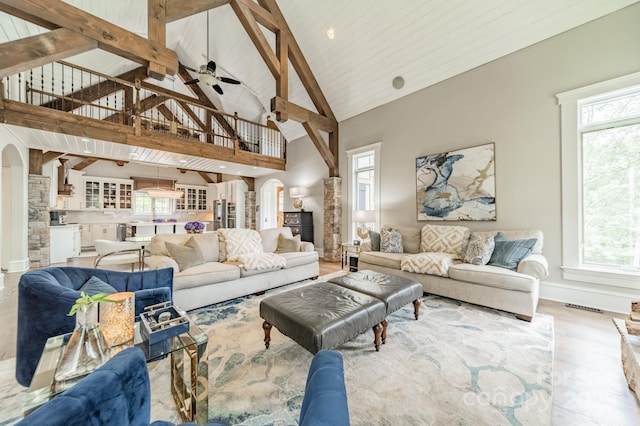 3587 Ridgetop Rd, Sherrills Ford, NC 28673 - living area featuring high vaulted ceiling, healthy amount of natural light, arched walkways, wood finished floors, and a ceiling fan