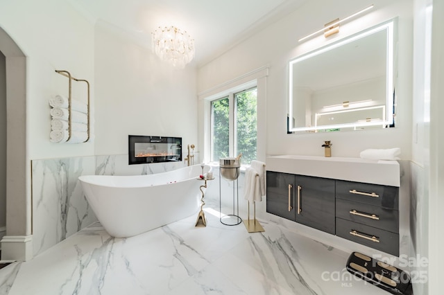 3587 Ridgetop Rd, Sherrills Ford, NC 28673 - bathroom with marble tiled flooring, vanity, a freestanding bath, a chandelier, and a wainscoted wall