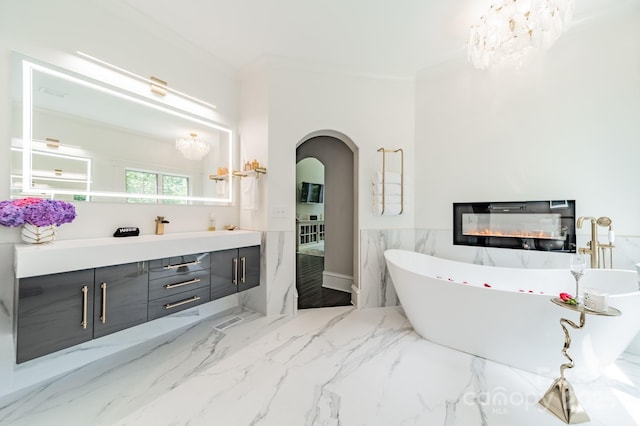 3587 Ridgetop Rd, Sherrills Ford, NC 28673 - bathroom featuring double vanity, a freestanding tub, ornamental molding, and marble finish flooring