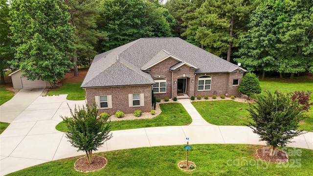 106 Pier Point Dr, Stony Point, NC 28678 - view of front facade featuring an outbuilding, brick siding, a front yard, and roof with shingles