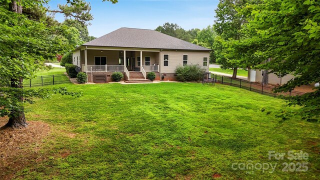 106 Pier Point Dr, Stony Point, NC 28678 - rear view of property featuring roof with shingles and a fenced backyard