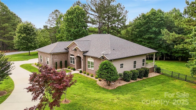 106 Pier Point Dr, Stony Point, NC 28678 - view of front facade featuring brick siding, a shingled roof, and driveway