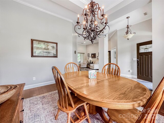 106 Pier Point Dr, Stony Point, NC 28678 - dining room with wood-type flooring and ornamental molding