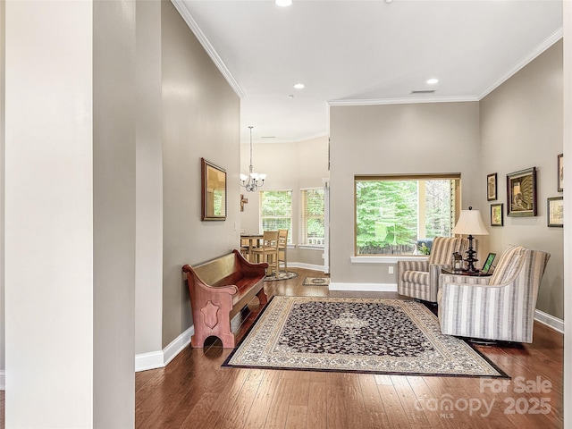 106 Pier Point Dr, Stony Point, NC 28678 - living area with hardwood / wood-style flooring, a chandelier, recessed lighting, and crown molding