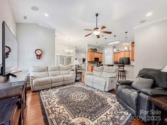 106 Pier Point Dr, Stony Point, NC 28678 - living area with light wood finished floors, ceiling fan, crown molding, a chandelier, and recessed lighting