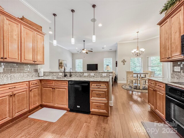 106 Pier Point Dr, Stony Point, NC 28678 - kitchen featuring black appliances, crown molding, a peninsula, light wood-type flooring, and ceiling fan