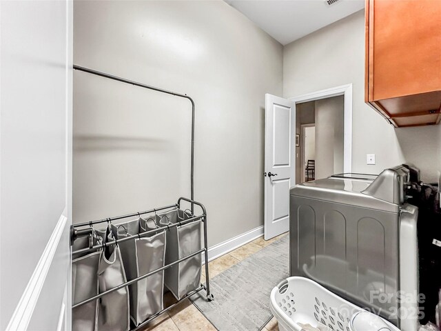 106 Pier Point Dr, Stony Point, NC 28678 - laundry room with washer / dryer and light tile patterned floors