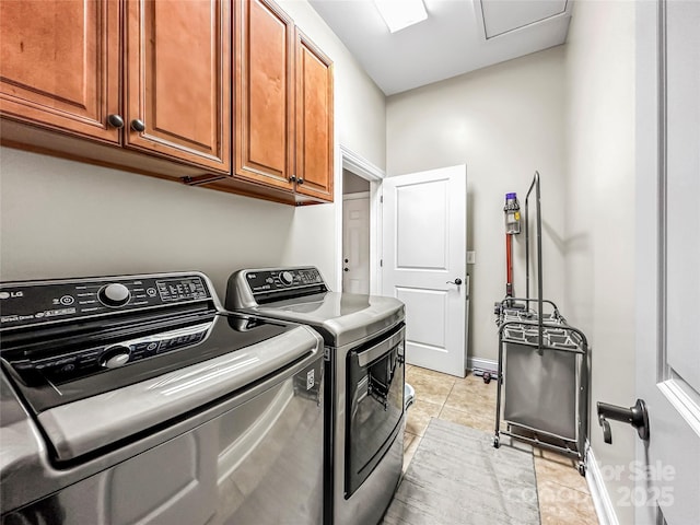 106 Pier Point Dr, Stony Point, NC 28678 - laundry room featuring cabinet space, light tile patterned floors, and washing machine and clothes dryer