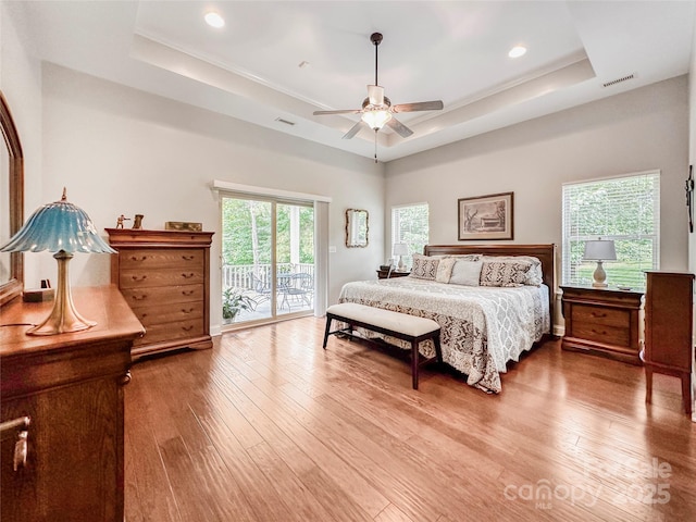 106 Pier Point Dr, Stony Point, NC 28678 - bedroom featuring a raised ceiling, access to exterior, wood finished floors, recessed lighting, and ceiling fan