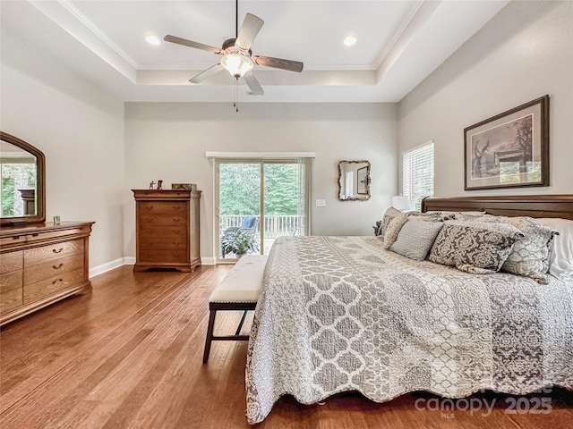 106 Pier Point Dr, Stony Point, NC 28678 - bedroom with a tray ceiling, access to outside, multiple windows, wood finished floors, and crown molding