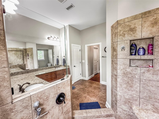 106 Pier Point Dr, Stony Point, NC 28678 - bathroom with vanity, tile patterned floors, and a tile shower