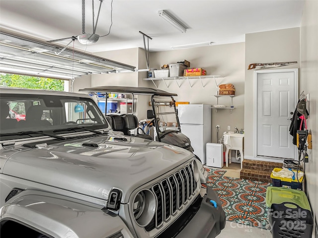 106 Pier Point Dr, Stony Point, NC 28678 - garage with freestanding refrigerator and a garage door opener