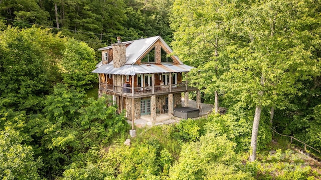 1145 Eagles Roost Rd, Bryson City, NC 28713 - back of house with a view of trees, french doors, stone siding, a chimney, and a deck