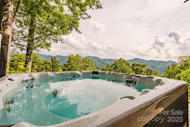 1145 Eagles Roost Rd, Bryson City, NC 28713 - view of swimming pool featuring a hot tub and a mountain view