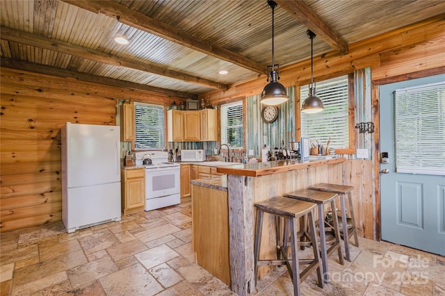 1145 Eagles Roost Rd, Bryson City, NC 28713 - kitchen with white appliances, light brown cabinets, stone tile floors, a kitchen breakfast bar, and a wooden ceiling with exposed beams