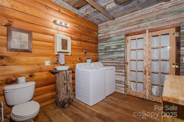 1145 Eagles Roost Rd, Bryson City, NC 28713 - bathroom featuring washing machine and clothes dryer and hardwood / wood-style floors