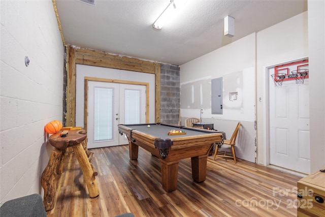 1145 Eagles Roost Rd, Bryson City, NC 28713 - game room with electric panel, french doors, billiards, wood finished floors, and concrete block wall