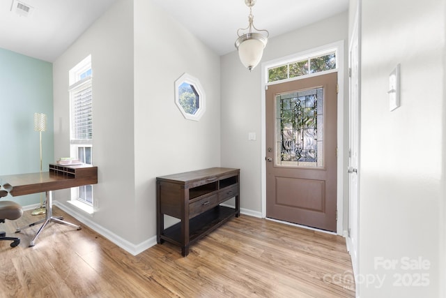 5104 Timbertop Ln, Charlotte, NC 28215 - entryway featuring light wood finished floors and healthy amount of natural light