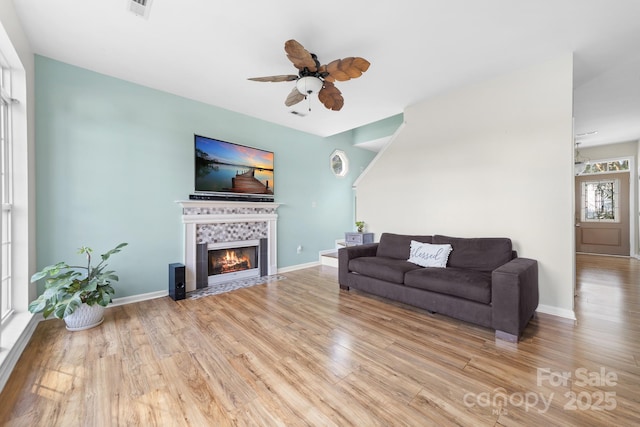 5104 Timbertop Ln, Charlotte, NC 28215 - living area featuring wood finished floors, a ceiling fan, and a fireplace