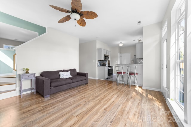 5104 Timbertop Ln, Charlotte, NC 28215 - living room featuring ceiling fan and light wood-style flooring