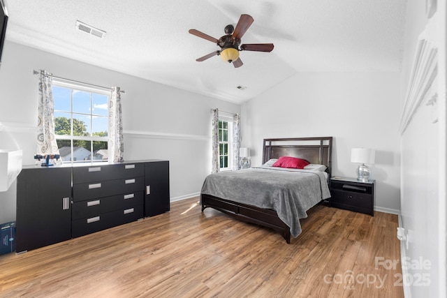 5104 Timbertop Ln, Charlotte, NC 28215 - bedroom featuring wood finished floors, vaulted ceiling, and ceiling fan