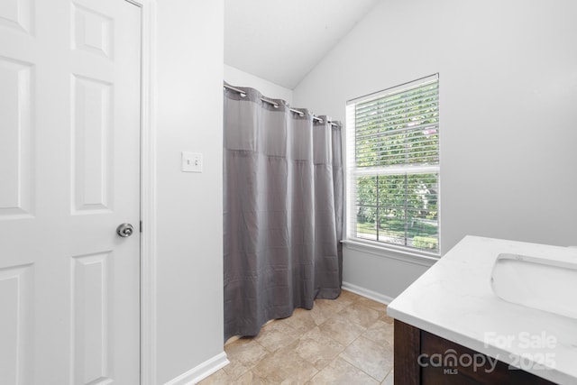 5104 Timbertop Ln, Charlotte, NC 28215 - full bath with vaulted ceiling, vanity, and curtained shower