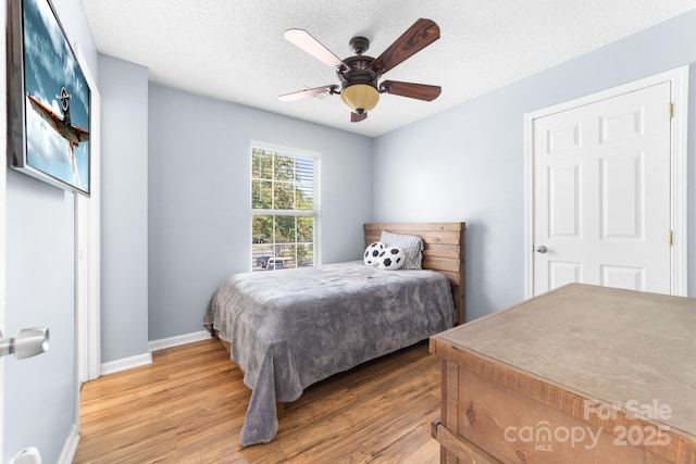 5104 Timbertop Ln, Charlotte, NC 28215 - bedroom with light wood-style floors and ceiling fan