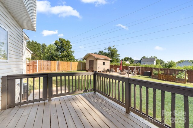 5104 Timbertop Ln, Charlotte, NC 28215 - deck featuring a storage unit and a fenced backyard