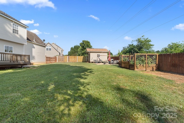 5104 Timbertop Ln, Charlotte, NC 28215 - fenced backyard featuring a storage unit and a vegetable garden