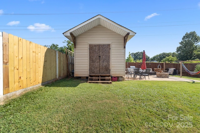 5104 Timbertop Ln, Charlotte, NC 28215 - view of shed featuring a fire pit and a fenced backyard