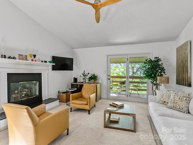 305 Piney Mountain Dr Unit B3, Asheville, NC 28805 - carpeted living area with a glass covered fireplace, lofted ceiling, a textured ceiling, and a ceiling fan