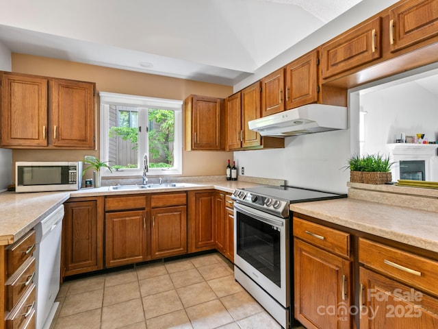 305 Piney Mountain Dr Unit B3, Asheville, NC 28805 - kitchen featuring appliances with stainless steel finishes, under cabinet range hood, and brown cabinets