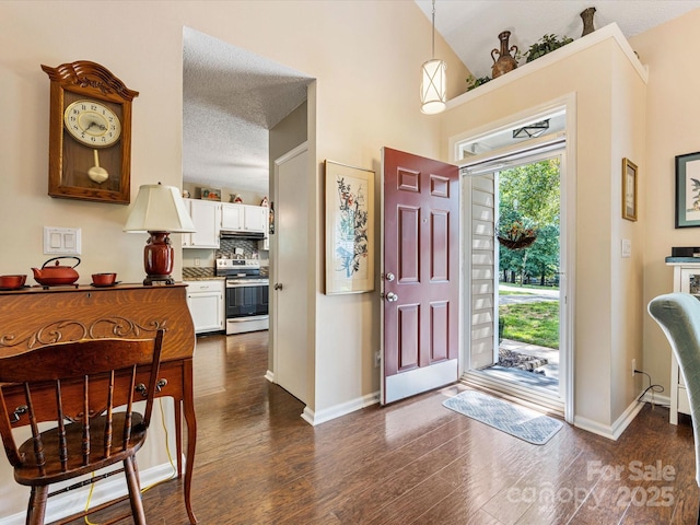 13600 Seastone Ln, Pineville, NC 28134 - entrance foyer with dark wood-style flooring and vaulted ceiling