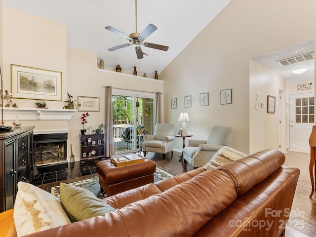 13600 Seastone Ln, Pineville, NC 28134 - living area featuring a ceiling fan, high vaulted ceiling, wood finished floors, and a fireplace with flush hearth