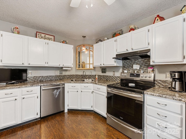 13600 Seastone Ln, Pineville, NC 28134 - kitchen with stainless steel appliances, under cabinet range hood, white cabinets, a textured ceiling, and dark wood-style floors