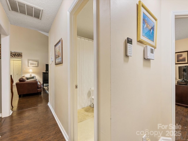 13600 Seastone Ln, Pineville, NC 28134 - corridor featuring a textured ceiling and dark wood finished floors