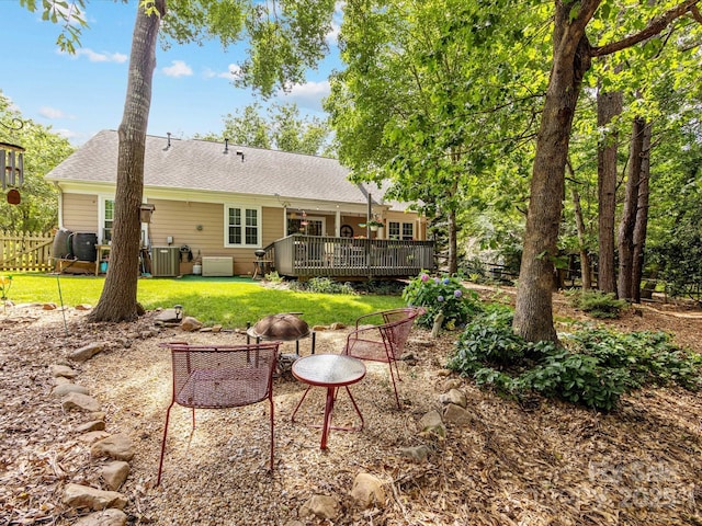13600 Seastone Ln, Pineville, NC 28134 - rear view of property featuring a wooden deck, a shingled roof, and a lawn