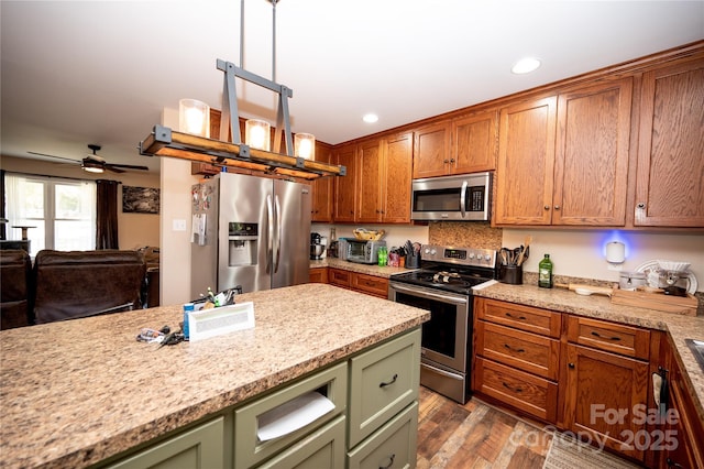3330 Clinzo Feemster Rd, Hickory Grove, SC 29717 - kitchen featuring appliances with stainless steel finishes, green cabinets, recessed lighting, wood finished floors, and a ceiling fan