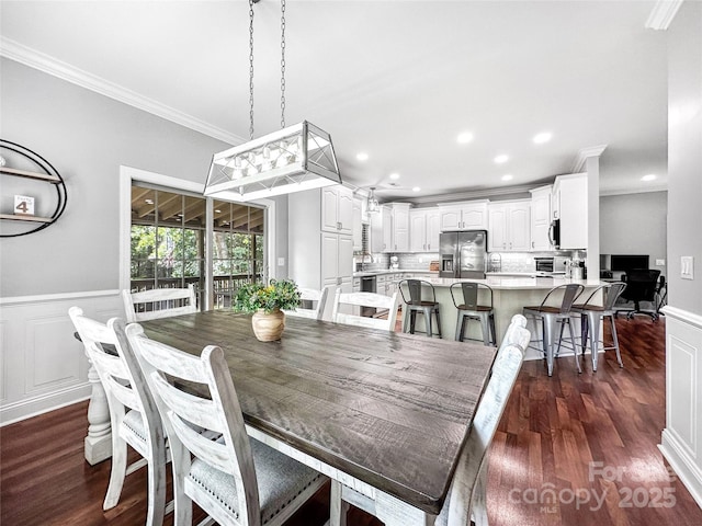 234 Rivercliff Dr, Stony Point, NC 28678 - dining area with ornamental molding, dark wood-style flooring, recessed lighting, and a wainscoted wall