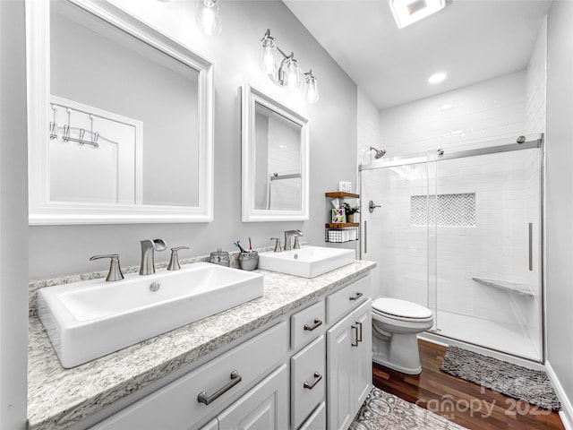 234 Rivercliff Dr, Stony Point, NC 28678 - bathroom with wood finished floors, a stall shower, double vanity, and recessed lighting