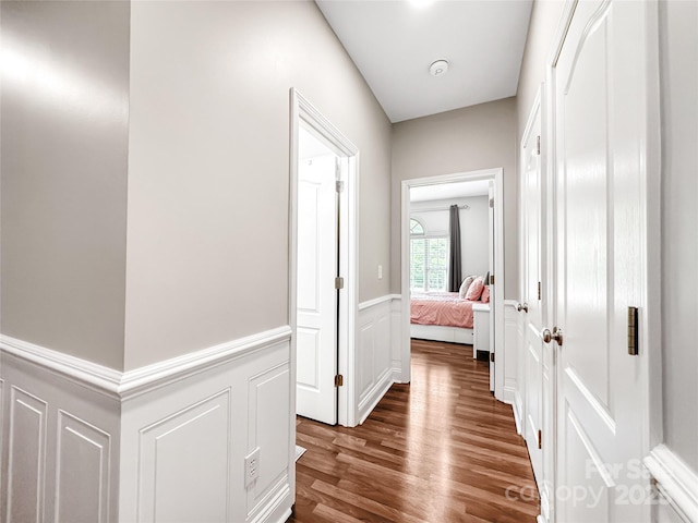 234 Rivercliff Dr, Stony Point, NC 28678 - hall with wood finished floors, a wainscoted wall, and a decorative wall