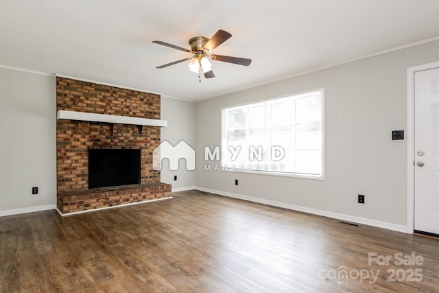 4308 Pinto Ln, Gastonia, NC 28052 - unfurnished living room with ceiling fan, wood finished floors, ornamental molding, and a brick fireplace