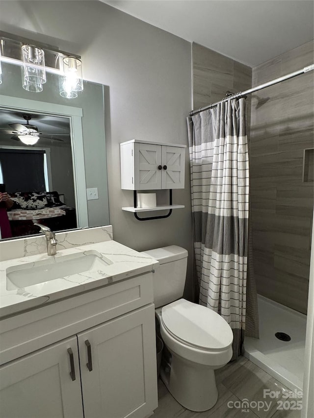 232 Harmony Hills Dr, Catawba, SC 29704 - bathroom featuring vanity, a tile shower, a ceiling fan, and tile patterned flooring
