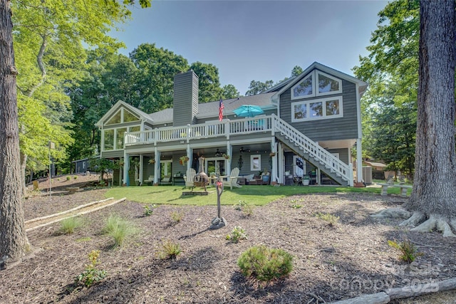 18205 Royal Oak Rd, Charlotte, NC 28278 - rear view of house featuring a ceiling fan, stairs, a chimney, and a wooden deck